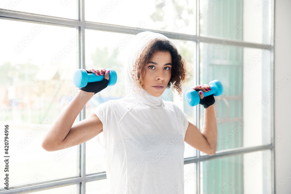 Young sporty woman is doing excercises and stretching Young sporty woman is doing excercises and stretching