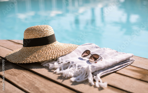 Sunglasses and straw hat
