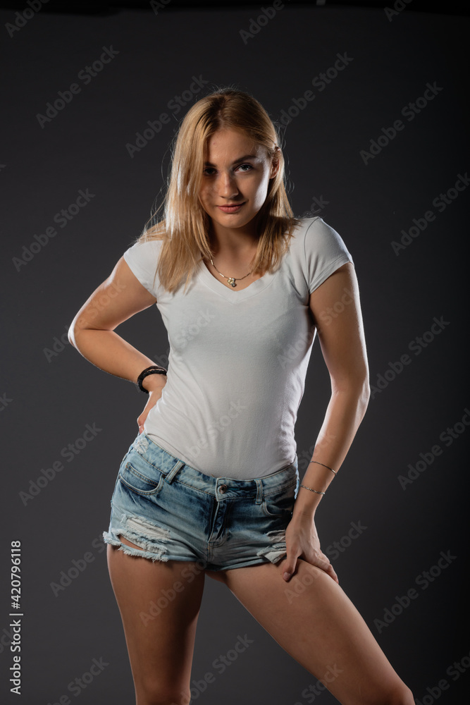 Attractive blonde in a casual urban clothes. Portrait. Isolated. Attractive blonde in a casual urban clothes. Portrait. Isolated.