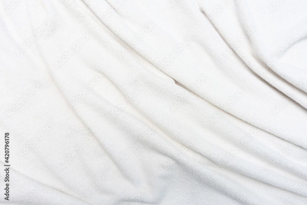 Fototapeta premium White crumpled plaid, texture, top view