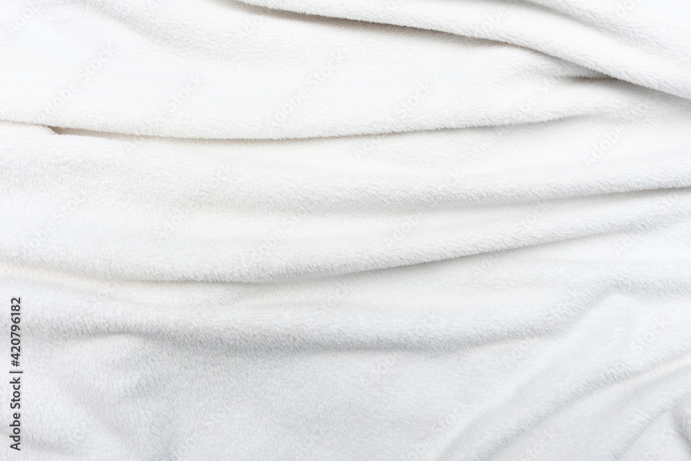White crumpled plaid, background with copy space, top view White crumpled plaid, background with copy space, top view