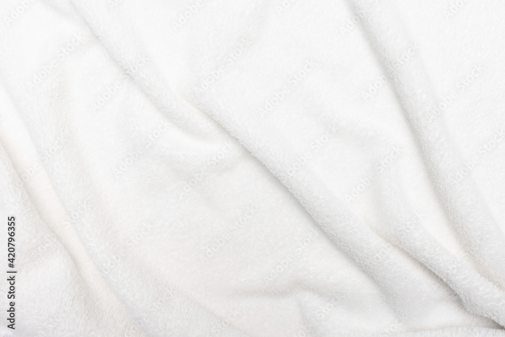 White crumpled blanket, background with copy space, top view