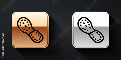 Gold and silver Human footprints shoes icon isolated on black background. Shoes sole. Long shadow style. Vector