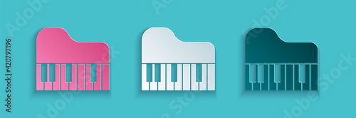 Paper cut Grand piano icon isolated on blue background. Musical instrument. Paper art style. Vector