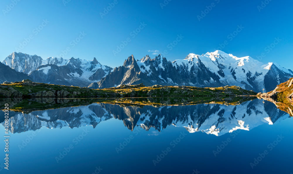 Sunset panorama of the Lac Blanc lake with Mont Blanc (Monte Bianco) on background, Chamonix location. Beautiful outdoor scene in Vallon de Berard Nature Reserve, France
