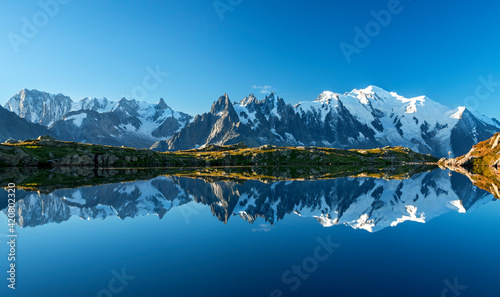 Obraz na płótnie Sunset panorama of the Lac Blanc lake with Mont Blanc (Monte Bianco) on background, Chamonix location. Beautiful outdoor scene in Vallon de Berard Nature Reserve, France w salonie