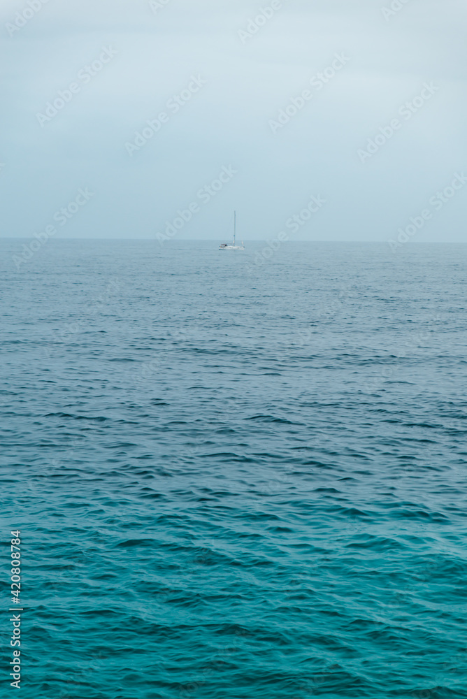 Obraz premium view on yacht boat in rainy overcast sea