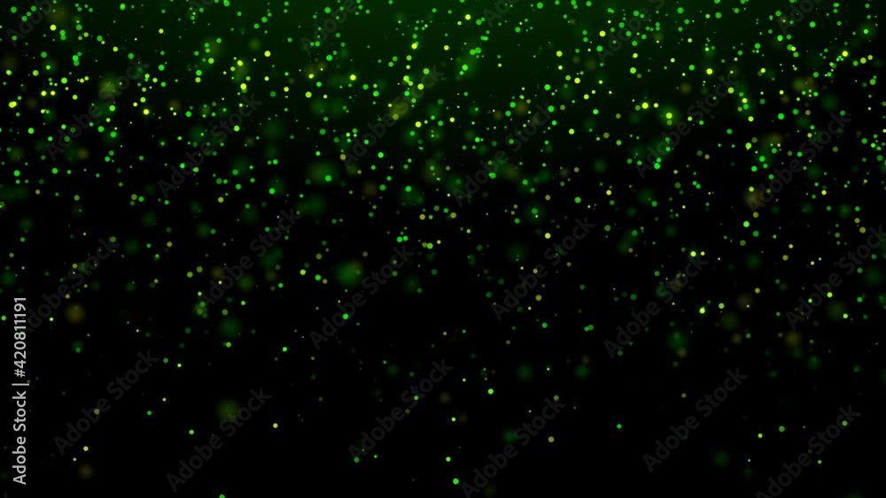 A looped motion background of falling emerald-green and gold sparkling particles. For St. Patrick's day. For Wallpapers, greetings, screensavers. Bright green and gold color, bokeh effect. A looped motion background of falling emerald-green and gold sparkling particles. For St. Patrick's day. For Wallpapers, greetings, screensavers. Bright green and gold color, bokeh effect.