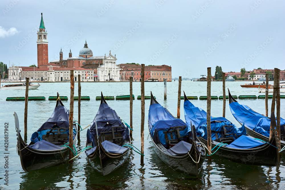 A view of San Giorgio Maggiore church seen from the main island in Venice, Italy, with gondolas in the foreground.