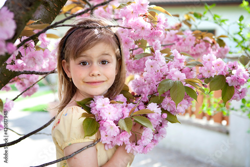 Girl inpink flowers photo