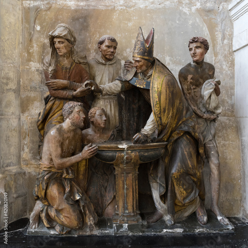 Troyes, France - September 26, 2018: Sculpture depicting the baptism of Saint Augustine in Troyes Cathedral.