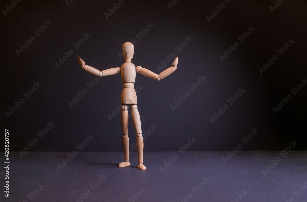 wooden gestalt on a black background. Gestalt in different poses wooden gestalt on a black background. Gestalt in different poses