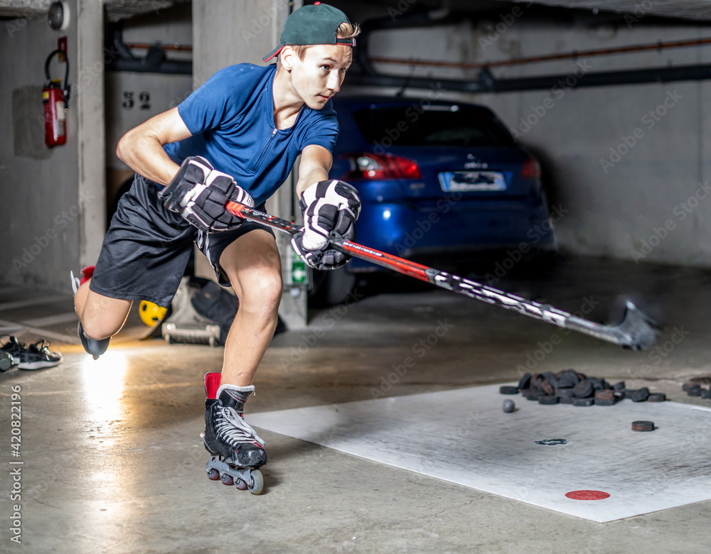 Fototapeta premium Young athlete fitness at home, ice hockey off ice fitness practice