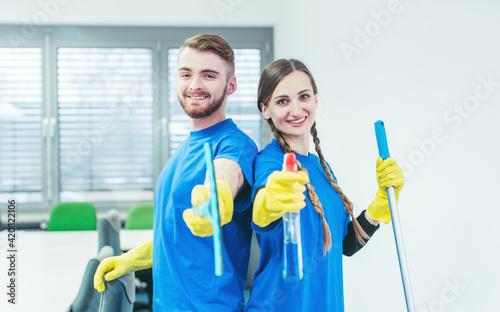 Woman and man in commercial cleaner team photo