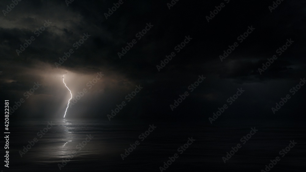 Dark mysterious monsoon cyclone storm clouds and multiple bolts of lightning. Tranquil eye of the storm above tropical Ocean at night. Conceptual establishing shot of powerful hurricane weather.