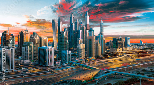 Obraz na płótnie DUBAI ,UNITED ARAB EMIRATES-FEBRUARY Beautifull , Dubai downtown at the sunset, Dubai, United
w salonie