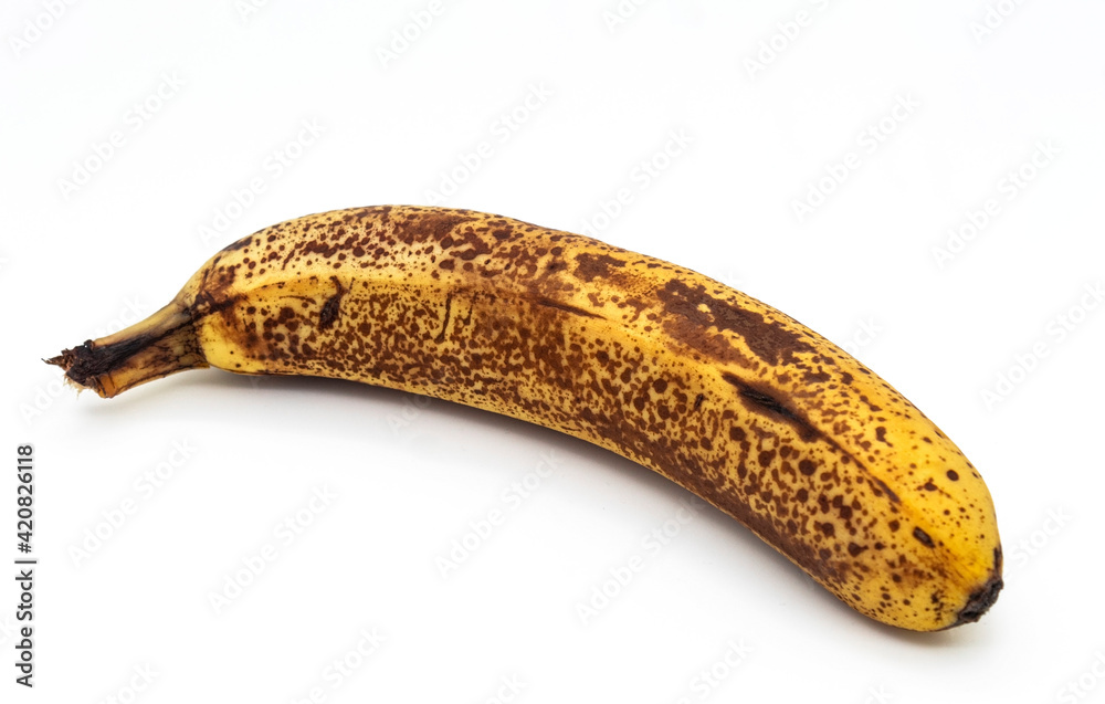 A single ripe banana isolated on a white background