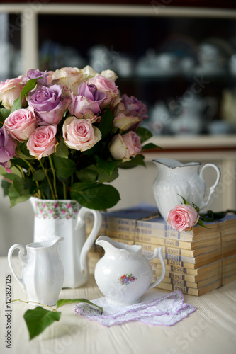 still-life with vintage white ware and pastel roses