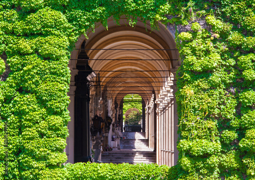 Croatia - Zagreb - Window framed with vegetation into the burial gallery on Mirogoj cemetry photo