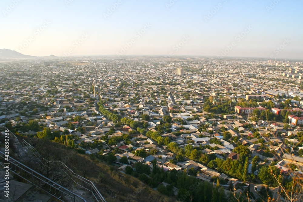 View over Osh town in sunset time, Kyrgyzstan. Panorama of Osh town from Sulaiman-Too mountain