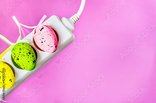 Happy Easter greeting card with electrical switch on pink background