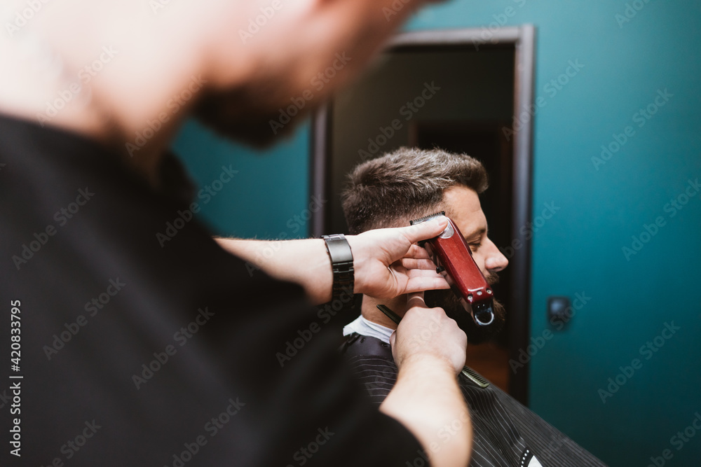 Man getting haircut in barbershop
