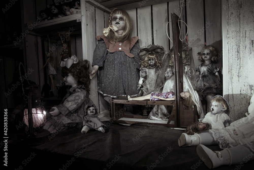 Scary dead dolls and the gallows. Dolls demons in an abandoned room. Scary dark black background.