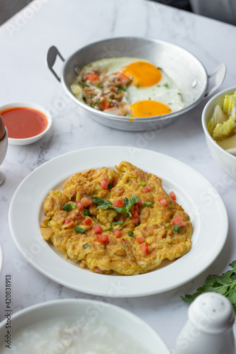 American and Thai breakfast set on the marble background