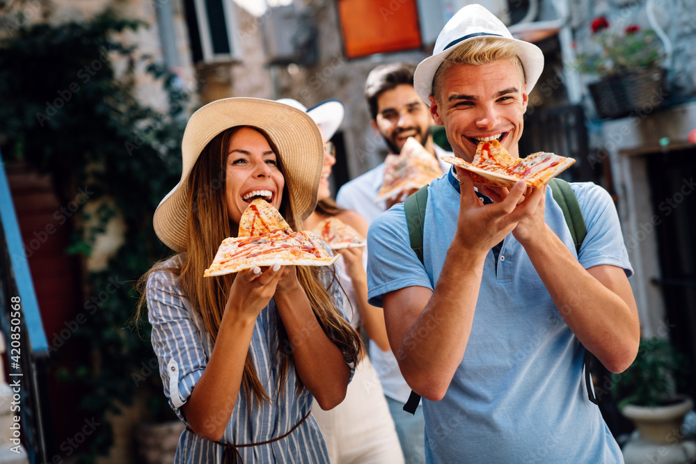 Happy group of friends enjoying traveling and vacation