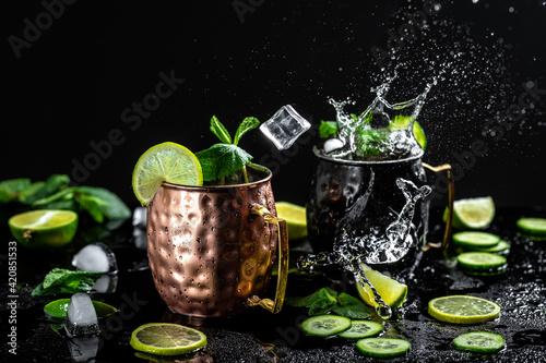 Canvastavla Moscow mule cocktail with lime, mint and cucumber splashes and ice frozen motion