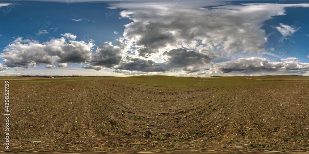 Fototapeta premium full seamless spherical hdri panorama 360 degrees angle view among farm fields in spring day awesome clouds in equirectangular projection, ready for VR AR virtual reality content
