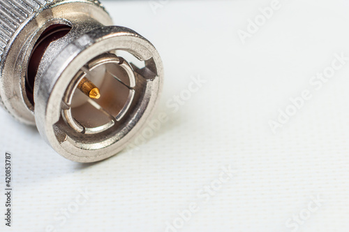 bnc connector for transmitting video and audio signal in filmmaking close-up on a white background, macro photography photo