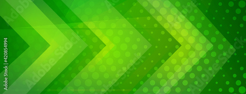 Abstract halftone background made of dots and geometric shapes in green colors