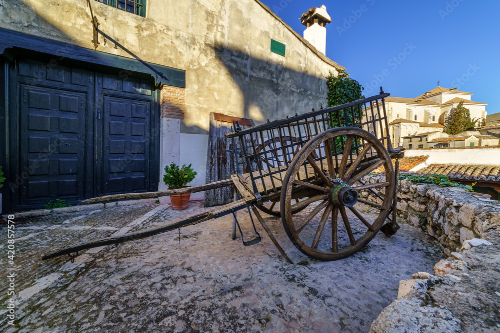 Fototapeta premium Old wooden cart drawn by animals for field work in ancient times. Chinchon, Madrid.