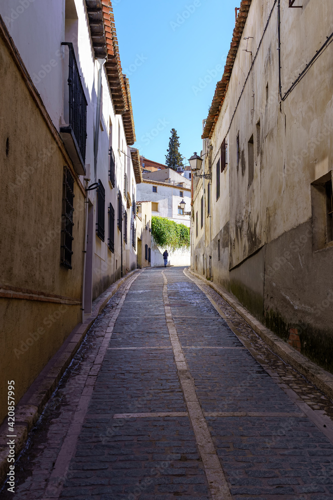 Typical narrow streets of the medieval town of Chinchón in Madrid, houses and old architecture in a quiet and relaxing environment.