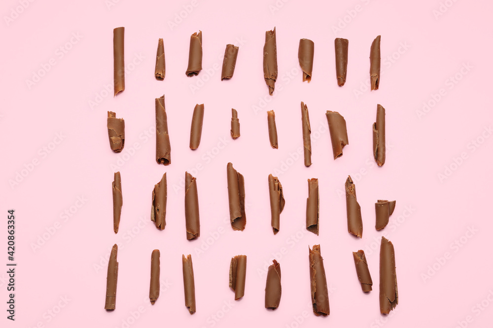 Delicious chocolate curls on color background Delicious chocolate curls on color background