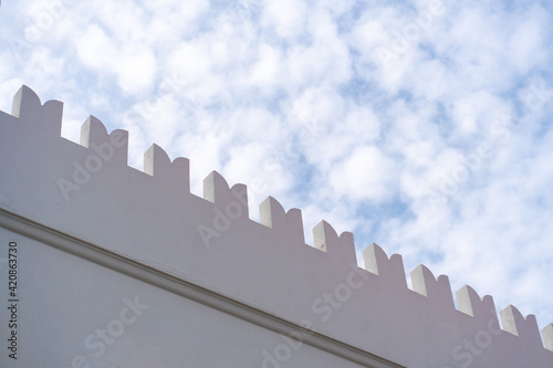 WHite Building Fascade Carved Roof Edge in Stone Town, Zanzibar photo