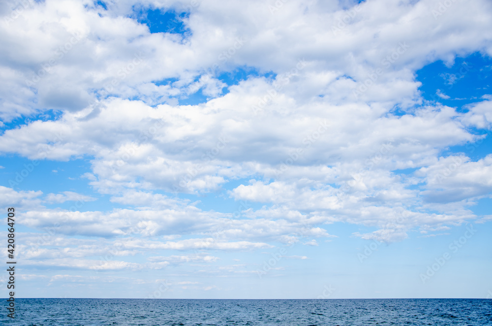 Seascape background blue sky with clouds