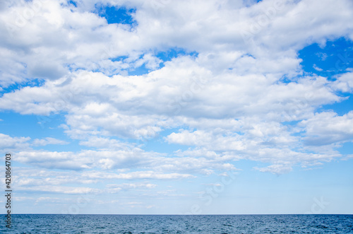 Seascape background blue sky with clouds