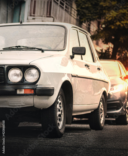 Detail of old car from the 80s model R12 at sunset on the street. © FabbriDG