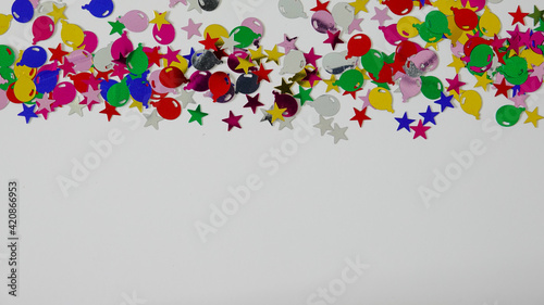 A colorful balloon and stars border with copy space.