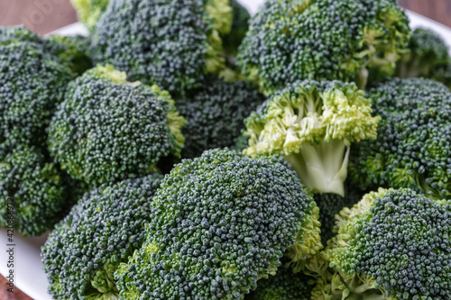  A lot of broccoli for diet and healthy eating. Fresh green broccoli on a table.Broccoli vegetable is full of vitamin.Vegetables for diet and healthy eating.Organic food.