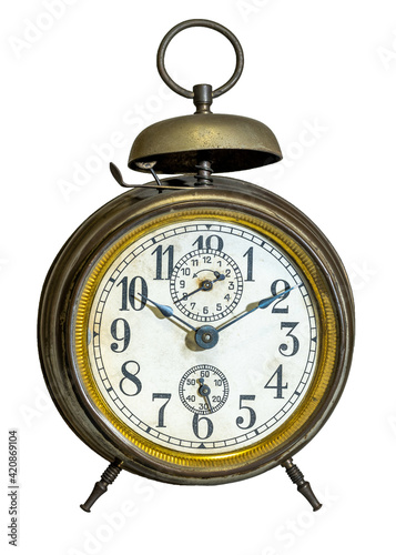 Old mechanical alarm clock with bell on the top, isolated
