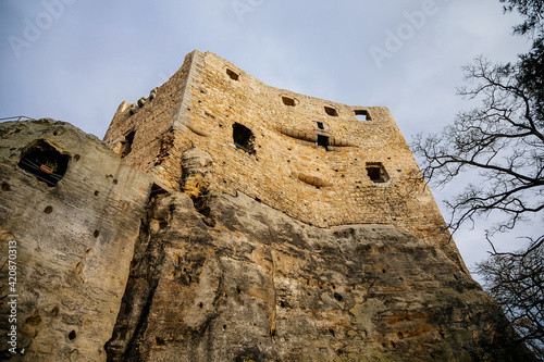 Stone gothic ruins of old rock medieval castle Valecov in sunny winter day before Christmas, ancient fortress on the top of the hill, Bohemian Paradise, Bosen, Czech Republic