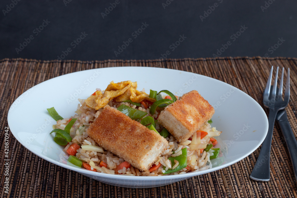 Fried rice with vegetable and tofu in egg and breadcrumbs 
