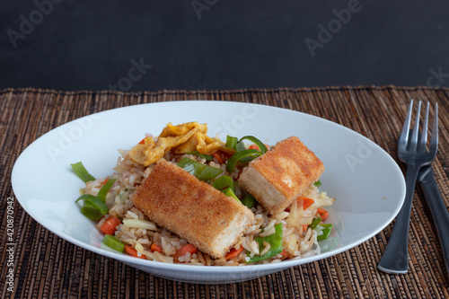 Fried rice with vegetable and tofu in egg and breadcrumbs 