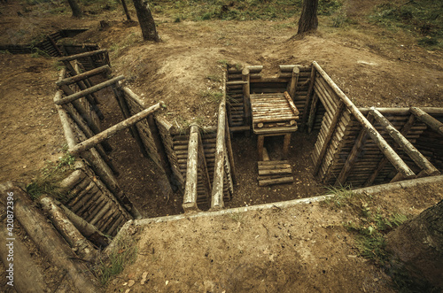 Wooden military dugout made of logs in the forest on the Mannerheim line photo