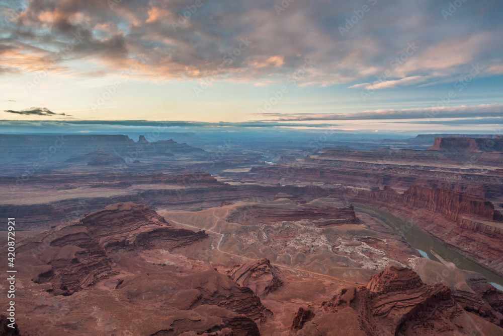 USA, Utah, Dead Horse Point State Park. Sunrise on Colorado River and canyon.