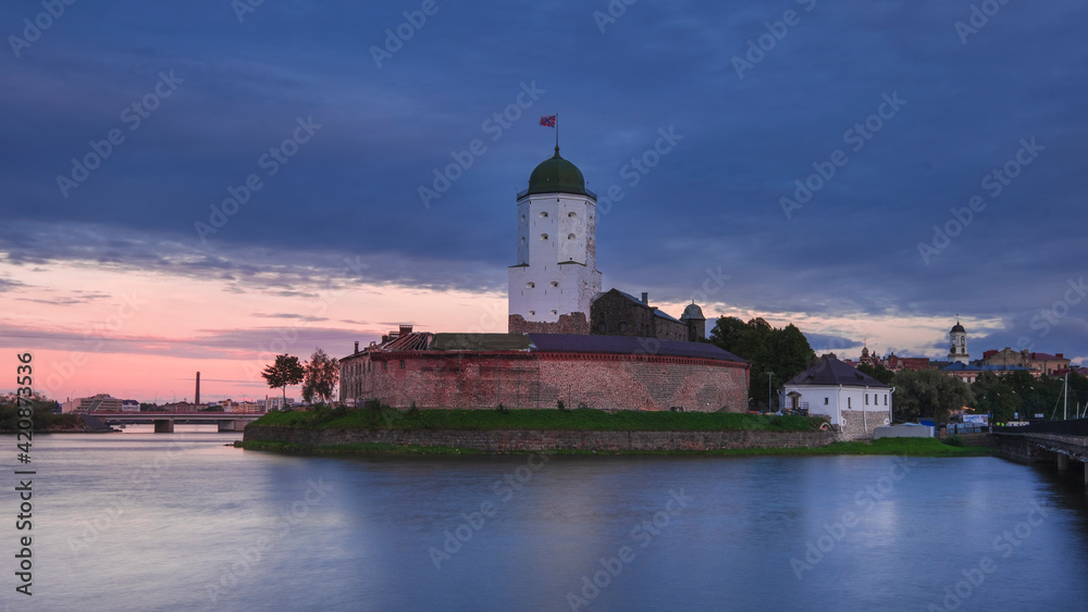 Ancient stone castle on the Island in Vyborg at summer sunset