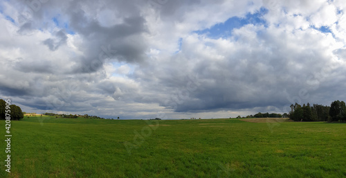 scenic panorama view of natural landscape under a cloudy sky © klickit24
